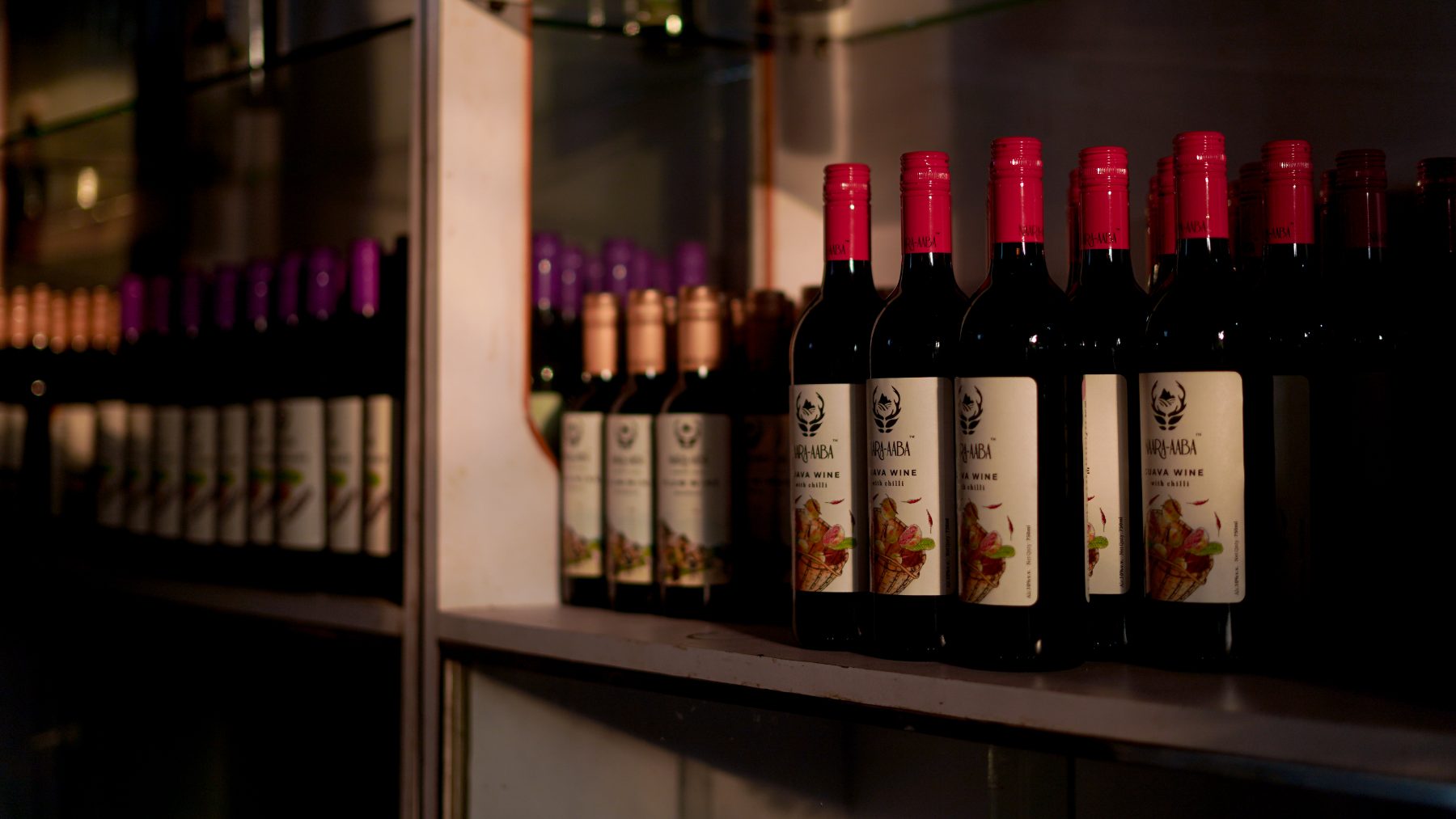 Nara Aaba guava and kiwi wine bottles on display