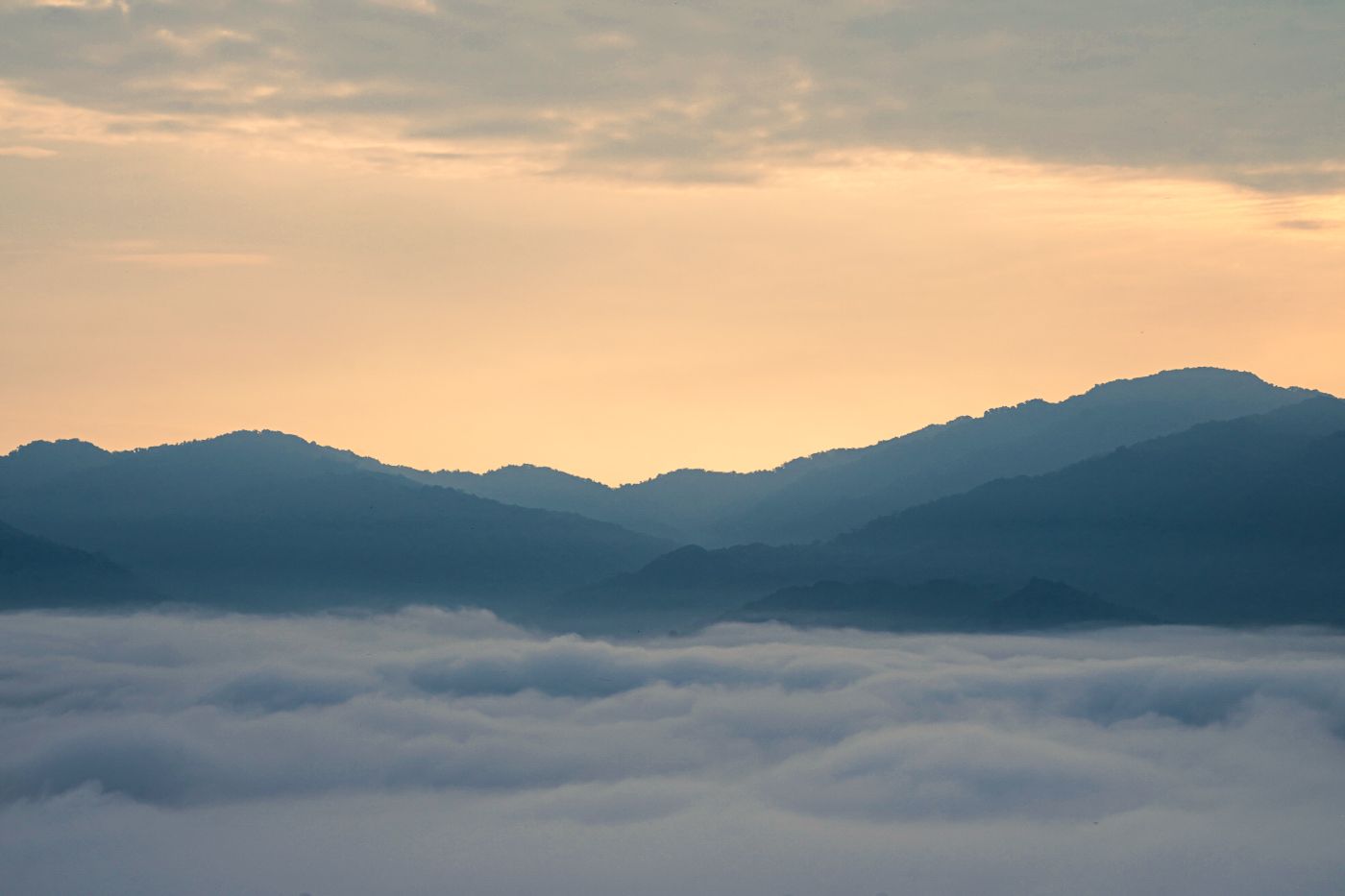 Mist lifting off the ridges at dawn above Ziro valley