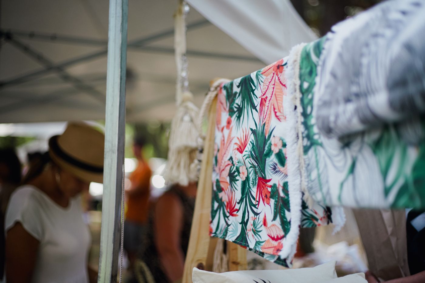 Tropical-print textiles at a festival market stall