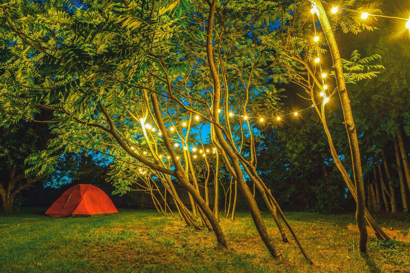 Tent under string lights at dusk